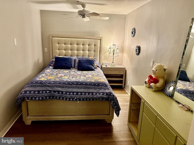 bedroom featuring ceiling fan and hardwood / wood-style floors