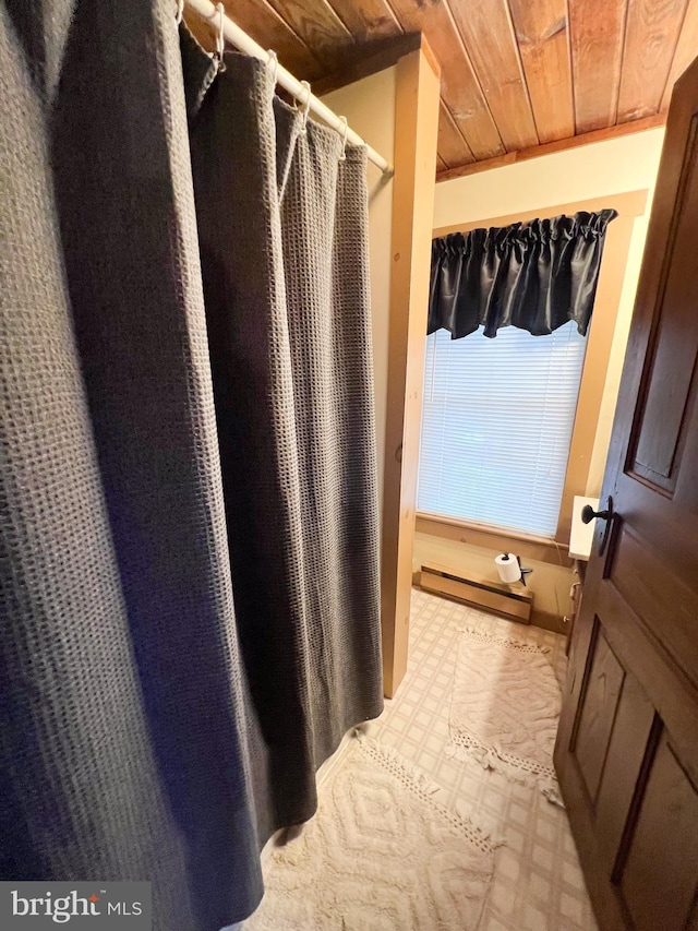 bathroom featuring a baseboard radiator and wooden ceiling