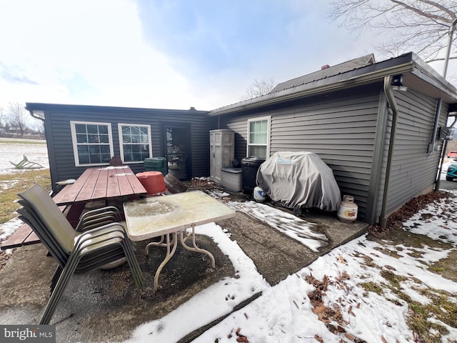 view of snow covered house