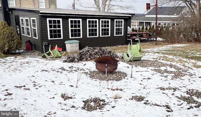 exterior space featuring an outdoor fire pit