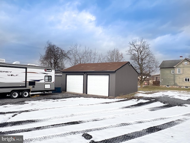 view of snow covered garage