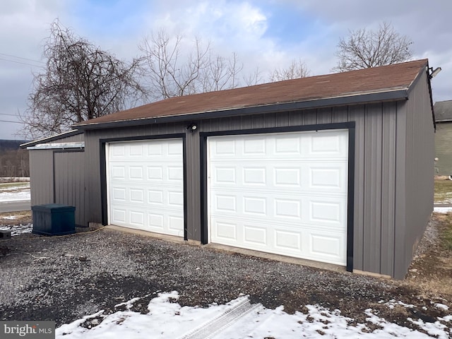 view of snow covered garage