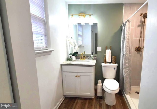 bathroom featuring toilet, wood-type flooring, vanity, and a shower with shower curtain