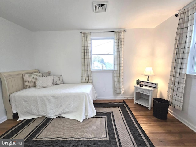 bedroom featuring dark hardwood / wood-style floors