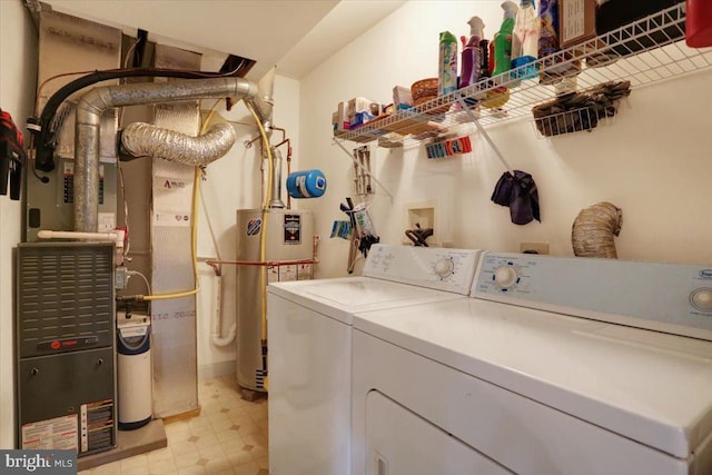 laundry area featuring washer and clothes dryer and water heater