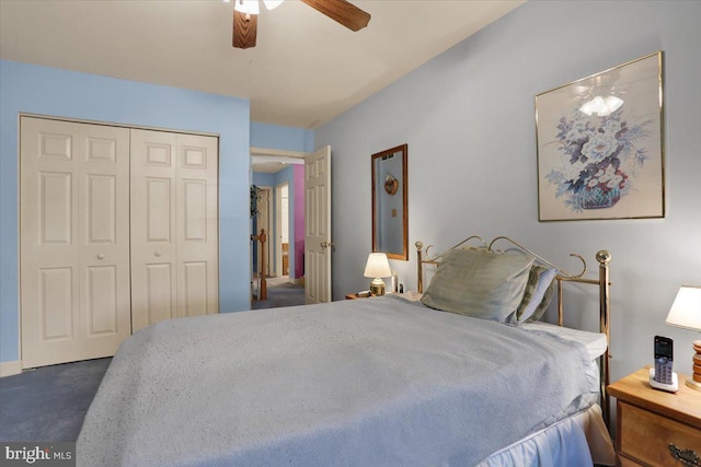 carpeted bedroom with ceiling fan and a closet