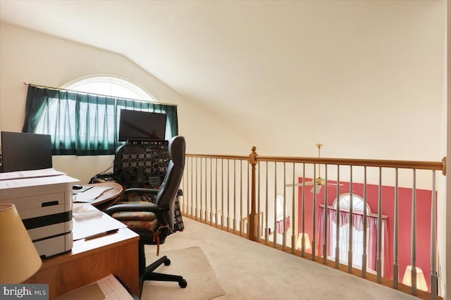 carpeted office with vaulted ceiling