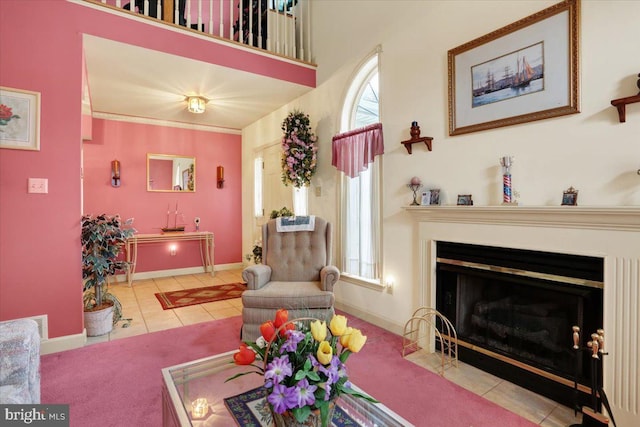 tiled living room with a towering ceiling