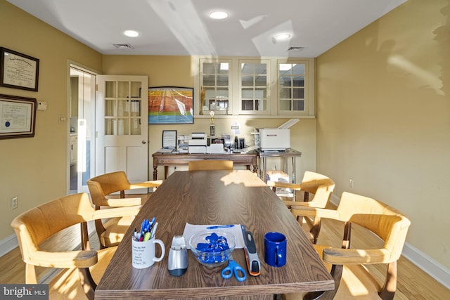 dining area featuring light wood-type flooring