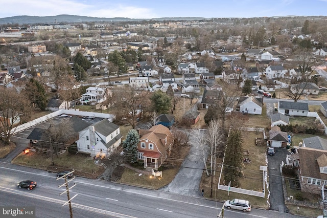 birds eye view of property with a mountain view