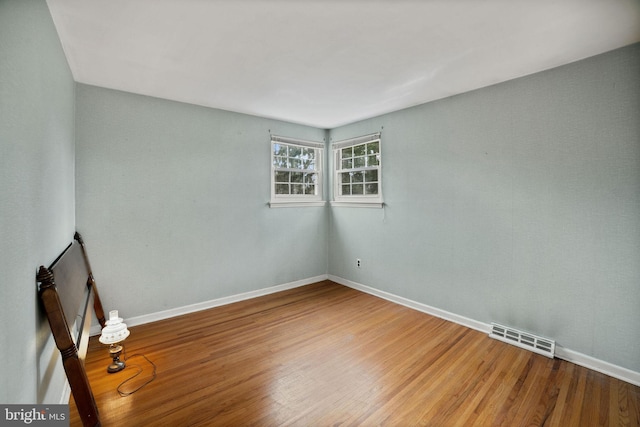 empty room featuring hardwood / wood-style floors