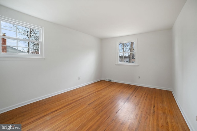 spare room featuring hardwood / wood-style floors