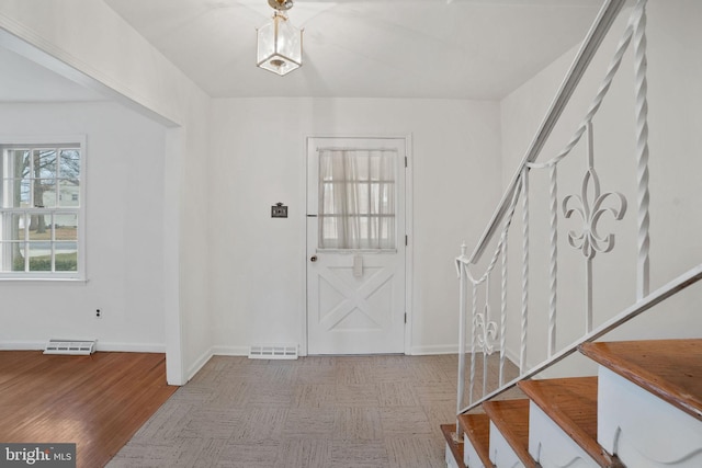 entryway with light hardwood / wood-style flooring