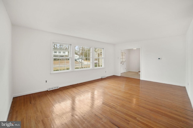 empty room featuring hardwood / wood-style floors