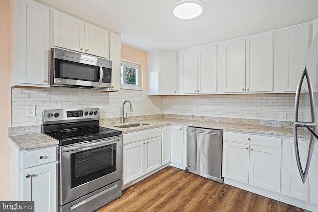 kitchen featuring white cabinets and appliances with stainless steel finishes