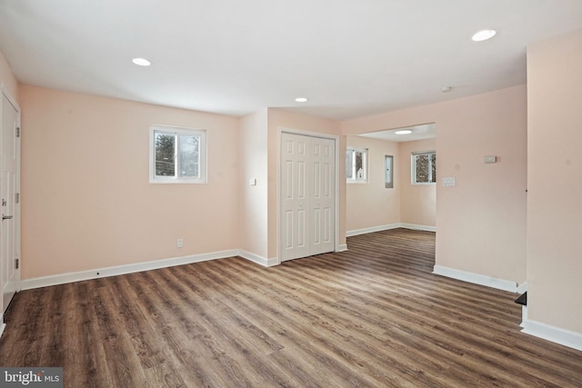 unfurnished room featuring dark hardwood / wood-style flooring