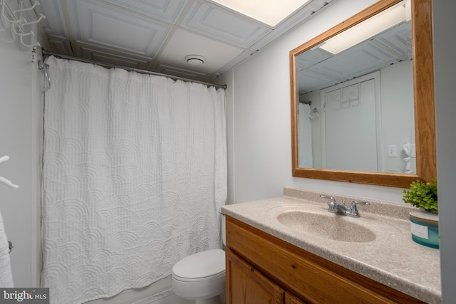 bathroom featuring toilet and vanity