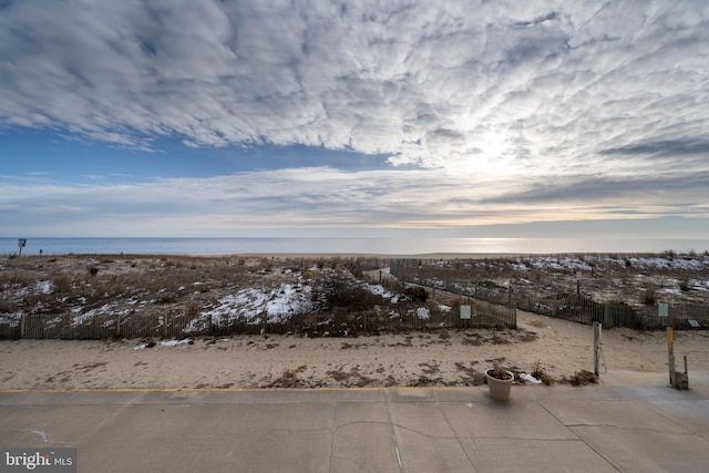 snowy aerial view with a water view