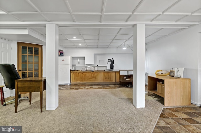 kitchen featuring carpet flooring and white refrigerator