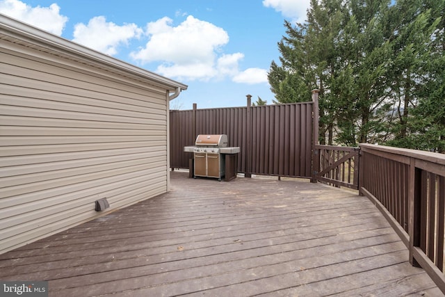 wooden deck featuring area for grilling