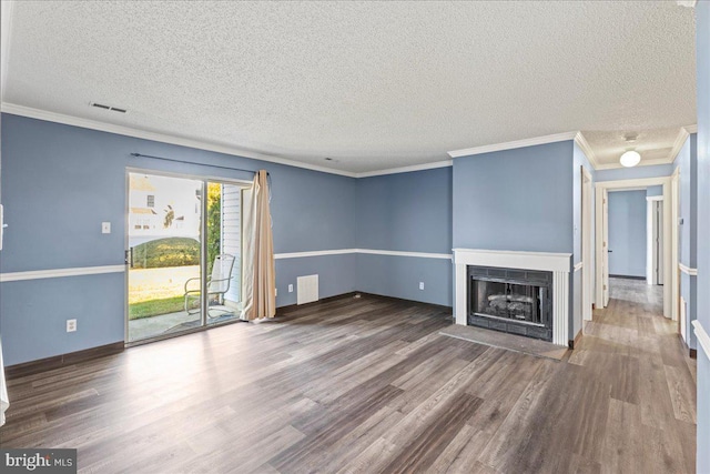 unfurnished living room featuring a textured ceiling, crown molding, and dark hardwood / wood-style floors