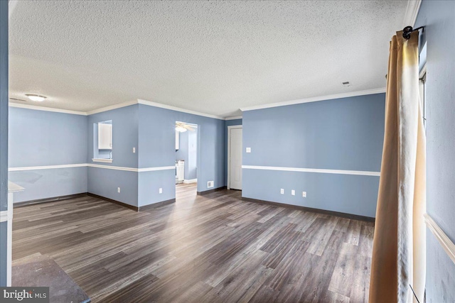 unfurnished room featuring hardwood / wood-style flooring, a textured ceiling, and ornamental molding