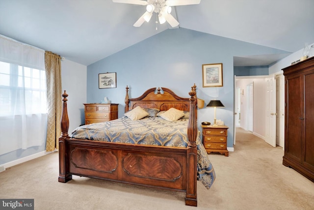 carpeted bedroom with ceiling fan and lofted ceiling