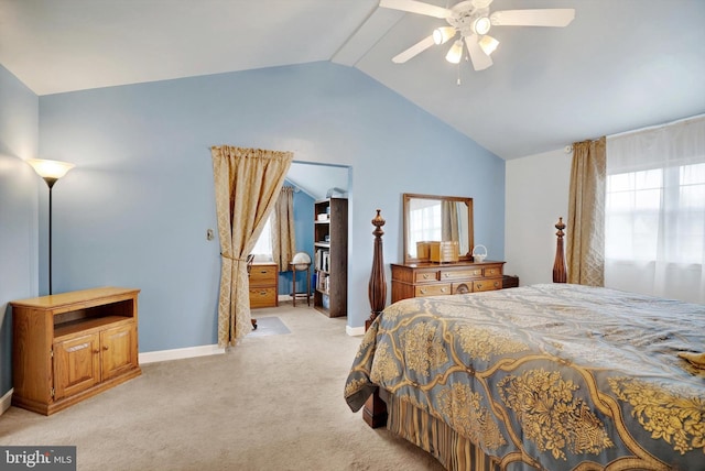 bedroom featuring ceiling fan, light carpet, and lofted ceiling