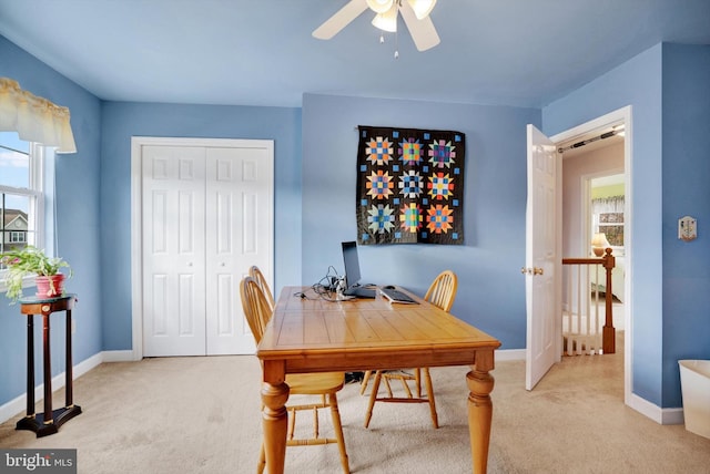 carpeted office with ceiling fan