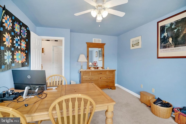 office space with ceiling fan and carpet