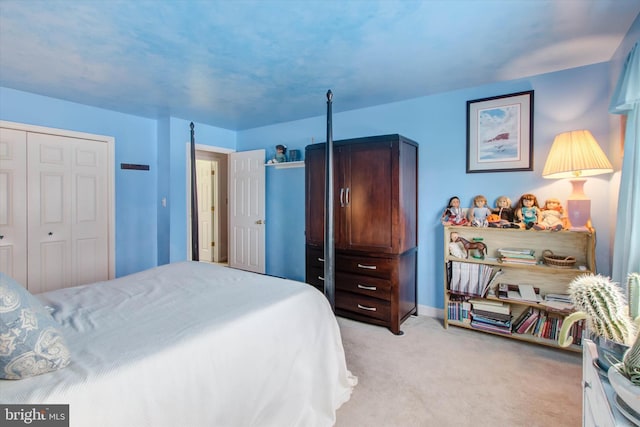 carpeted bedroom featuring a closet