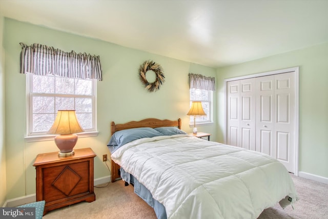 carpeted bedroom featuring a closet