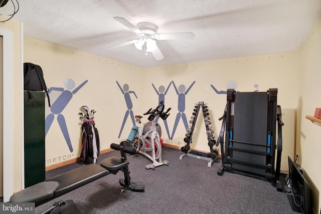 exercise room featuring a textured ceiling and ceiling fan