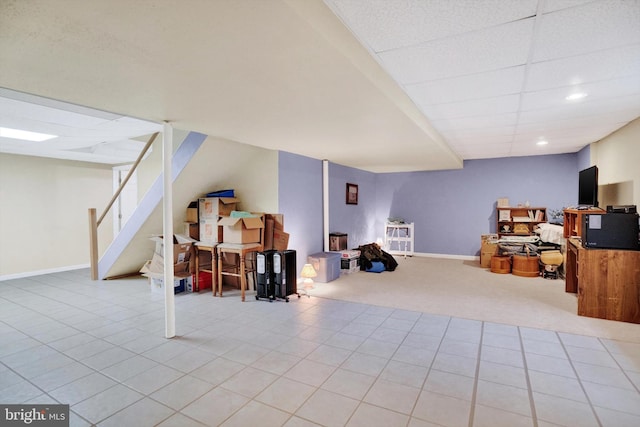 interior space featuring light carpet and a drop ceiling