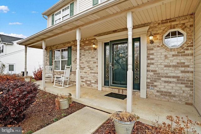 doorway to property with covered porch