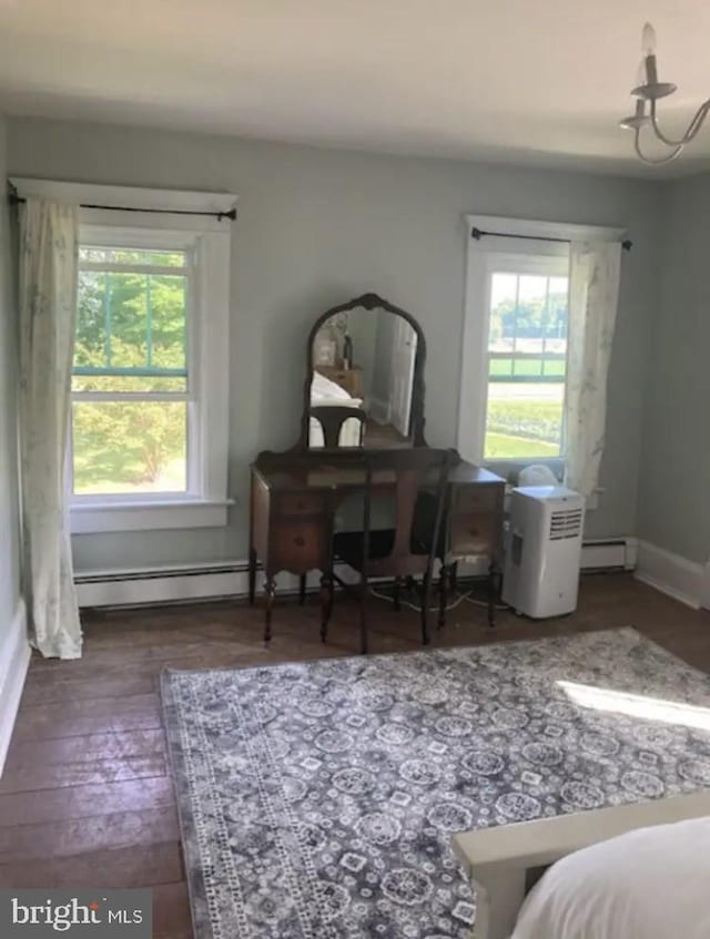 interior space featuring dark wood-type flooring and baseboard heating