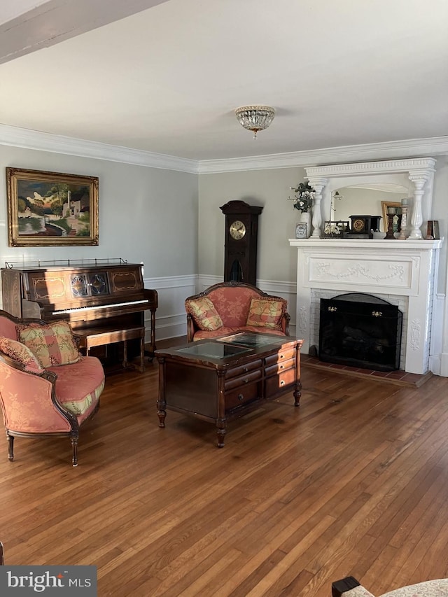 living room featuring crown molding and hardwood / wood-style flooring