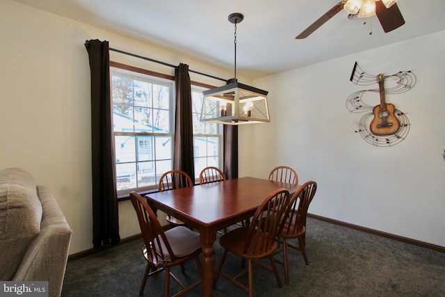 dining space with dark colored carpet and ceiling fan with notable chandelier