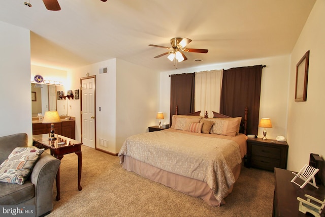 bedroom with ceiling fan and light colored carpet