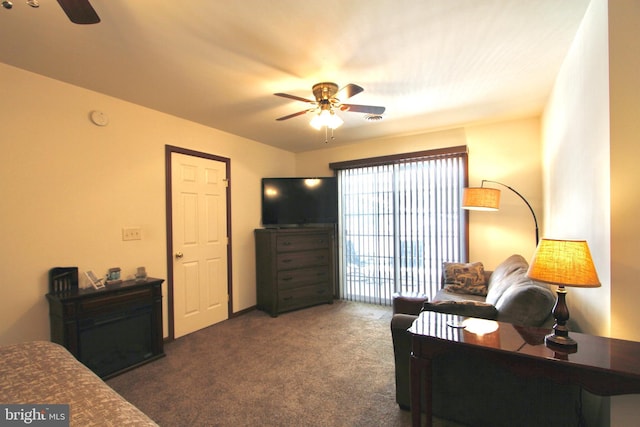 living room with ceiling fan and dark colored carpet