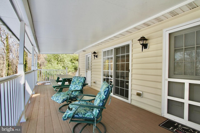 wooden terrace featuring a porch