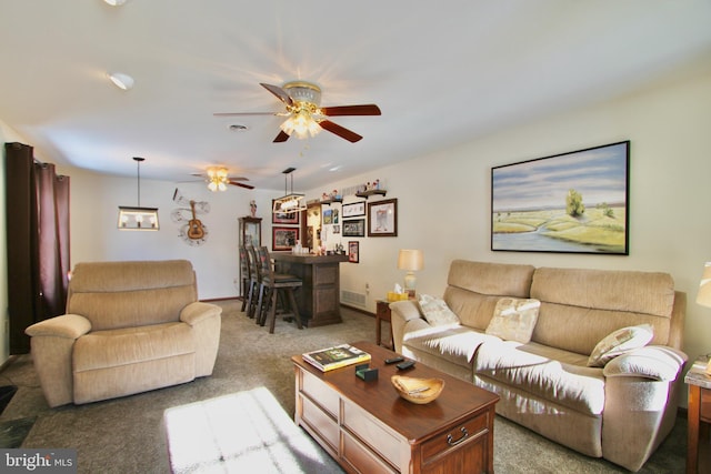 carpeted living room with ceiling fan