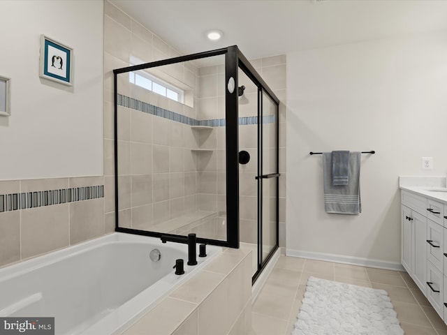 full bath with tile patterned flooring, a shower stall, baseboards, a bath, and vanity