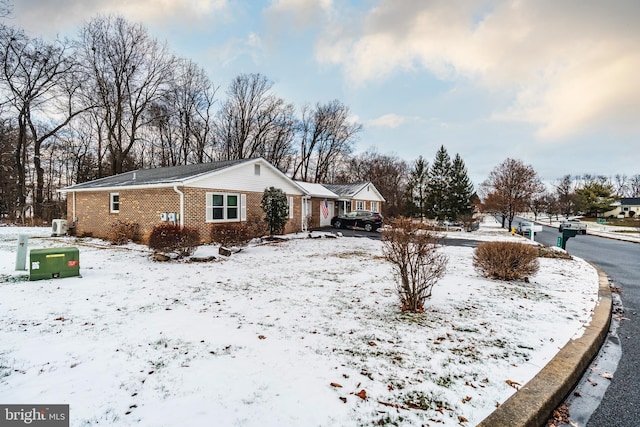 view of front of house with brick siding