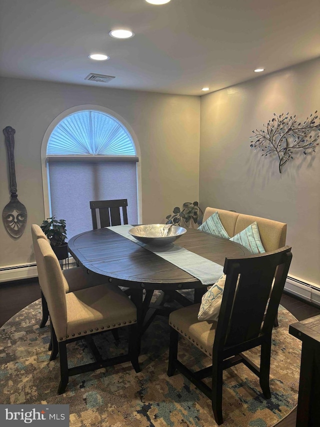 dining room with a baseboard radiator