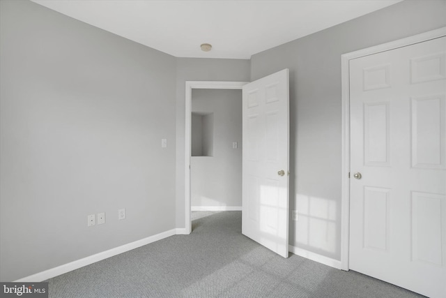 unfurnished bedroom with carpet