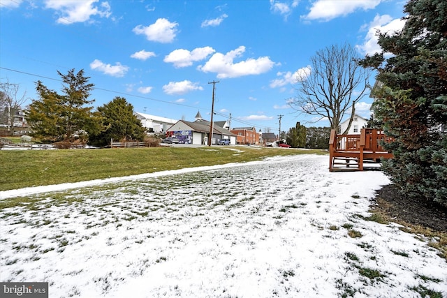 view of yard layered in snow