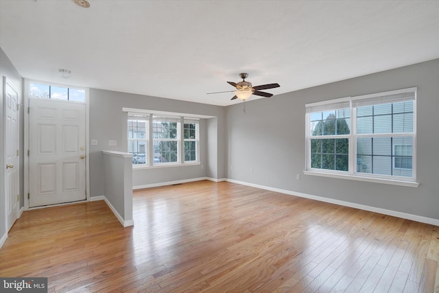 entryway with light hardwood / wood-style floors, plenty of natural light, and ceiling fan