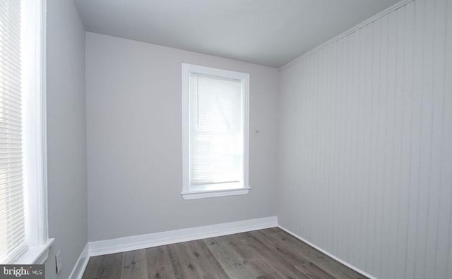 spare room featuring dark hardwood / wood-style floors