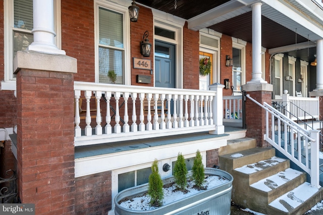 doorway to property featuring a porch